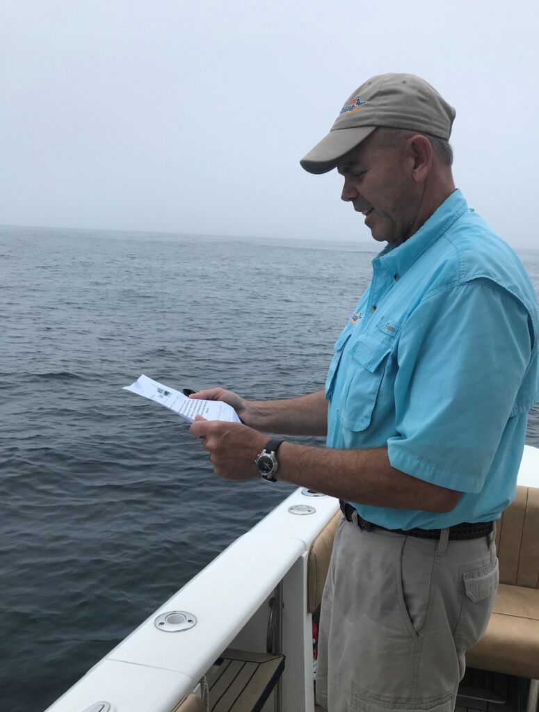 Captain Stu Rosen Facilitating a Scattering at Sea Service on the Charter Boat Metamorphosis